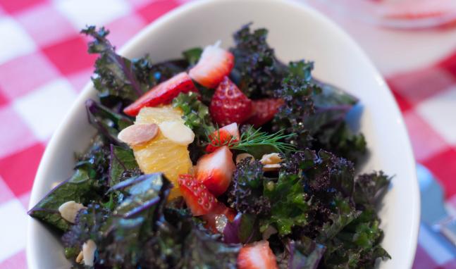 A close up of a bowl with salad