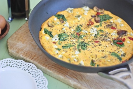 A pan of food on top of a wooden table.