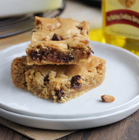 A white plate topped with two pieces of cookie dough bars.