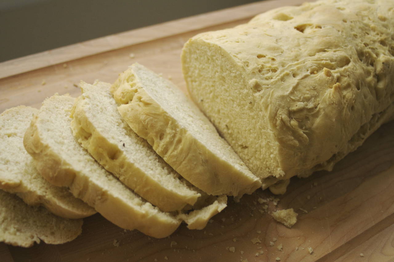 A loaf of bread is cut into slices.