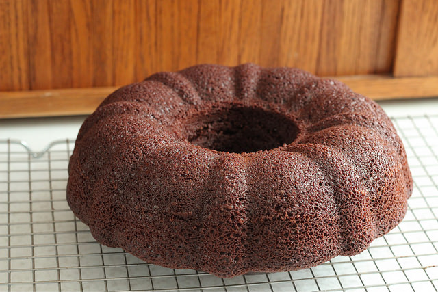 A bundt cake sitting on top of a cooling rack.