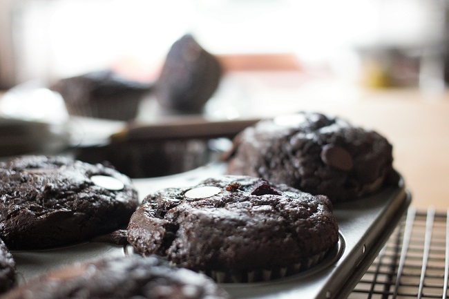 A close up of some chocolate muffins on a pan